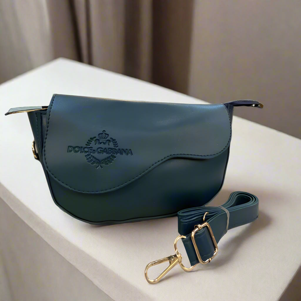 Blue handbag with visible brand logo on a striped surface