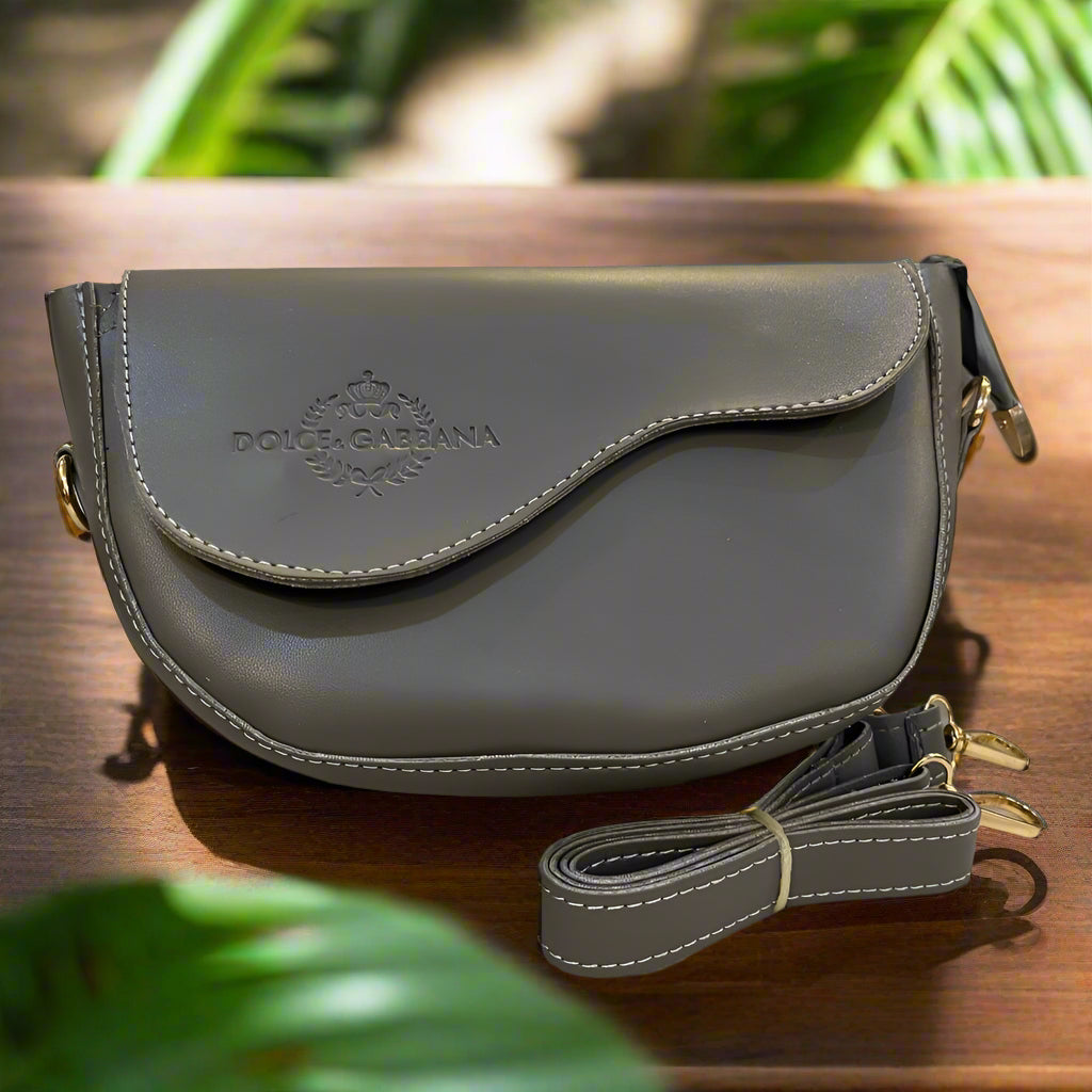 Gray handbag with visible brand logo on a light background