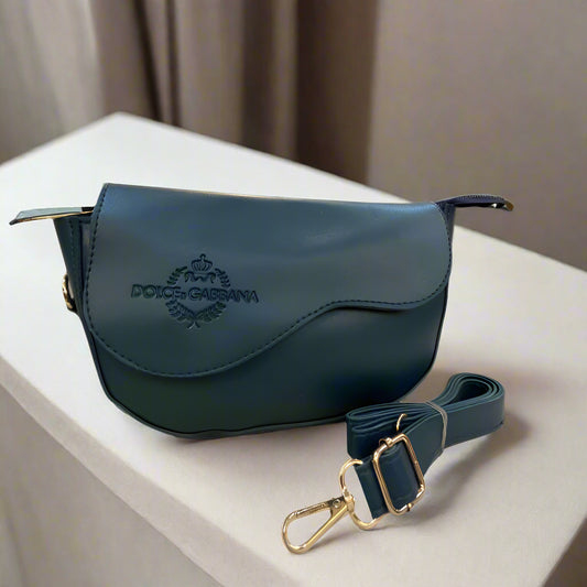 Blue handbag with visible brand logo on a striped surface