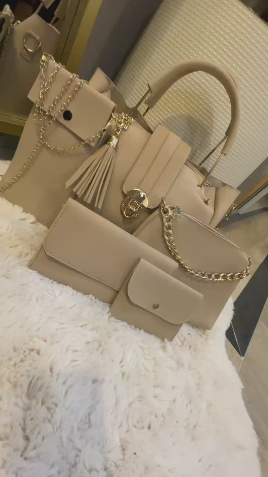 "Luxe Lock 5-in-1 pink structured tote handbag set from VIBE ELAN, featuring elegant gold hardware, multiple bag sizes, and versatile designs for everyday and formal use."